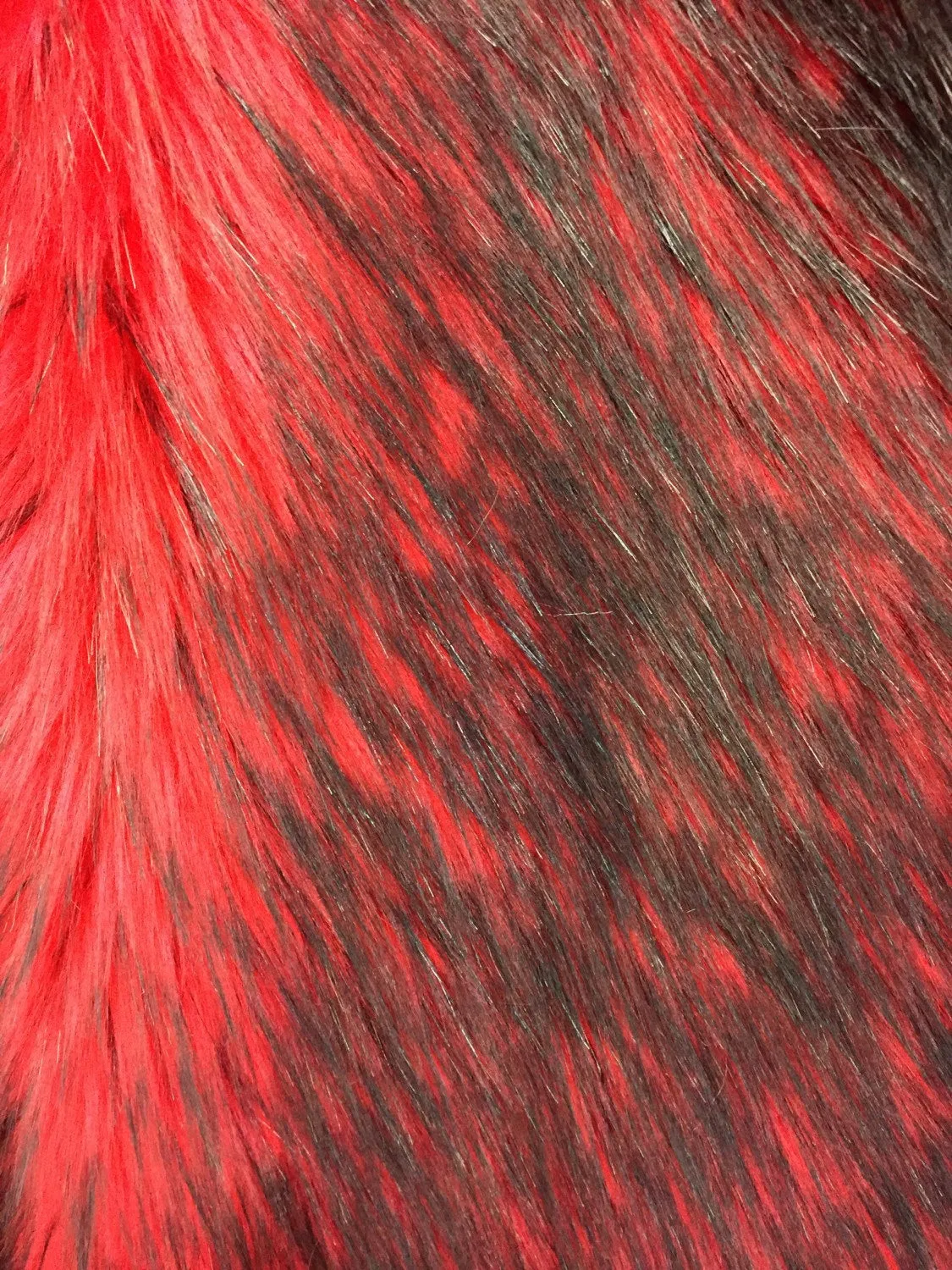 Red/black husky faux fur, 2 tone shaggy faux fur. Sold by the yard. 60" wide.